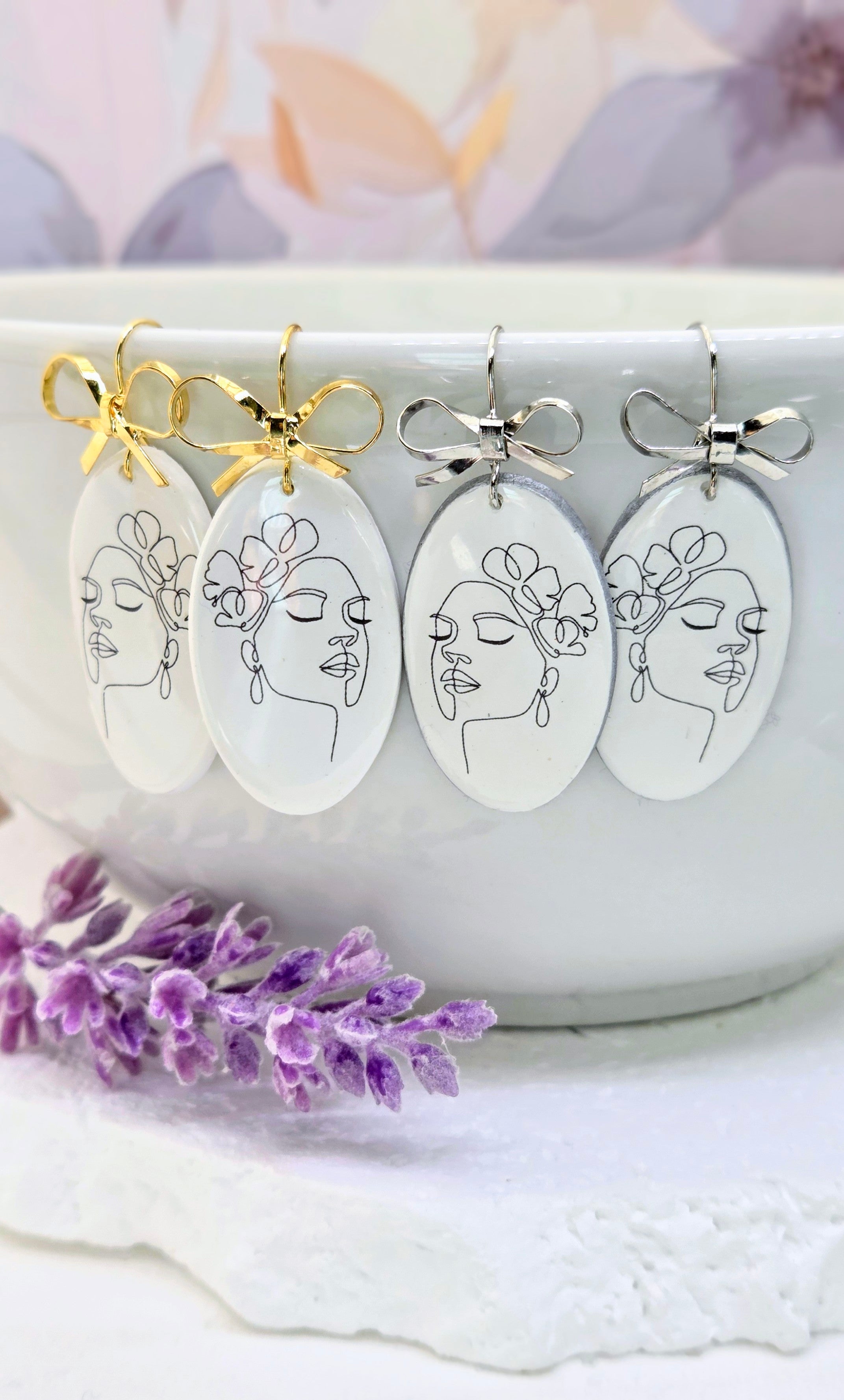 Abstract Face Clay Earrings with Bow Accent