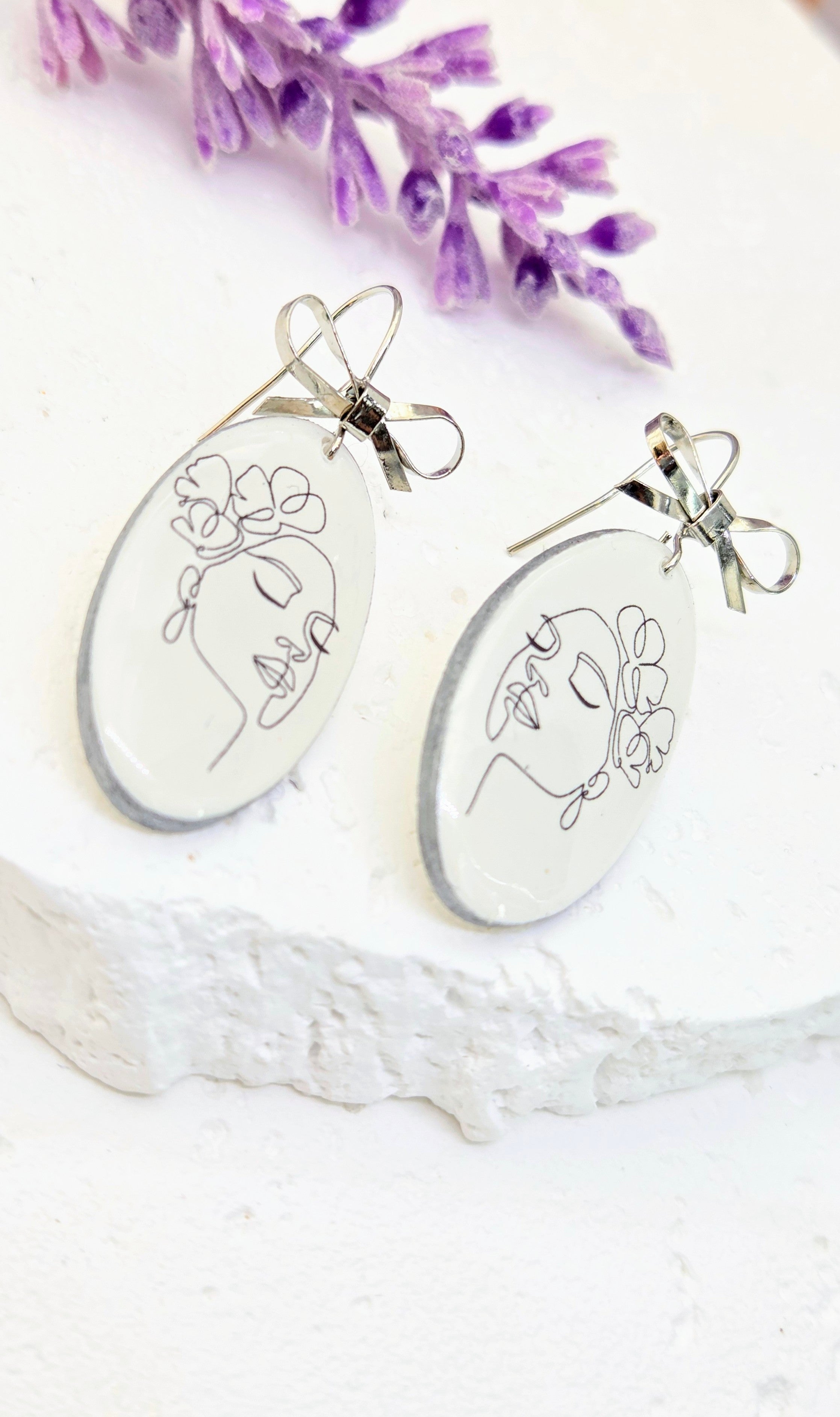 Abstract Face Clay Earrings with Bow Accent