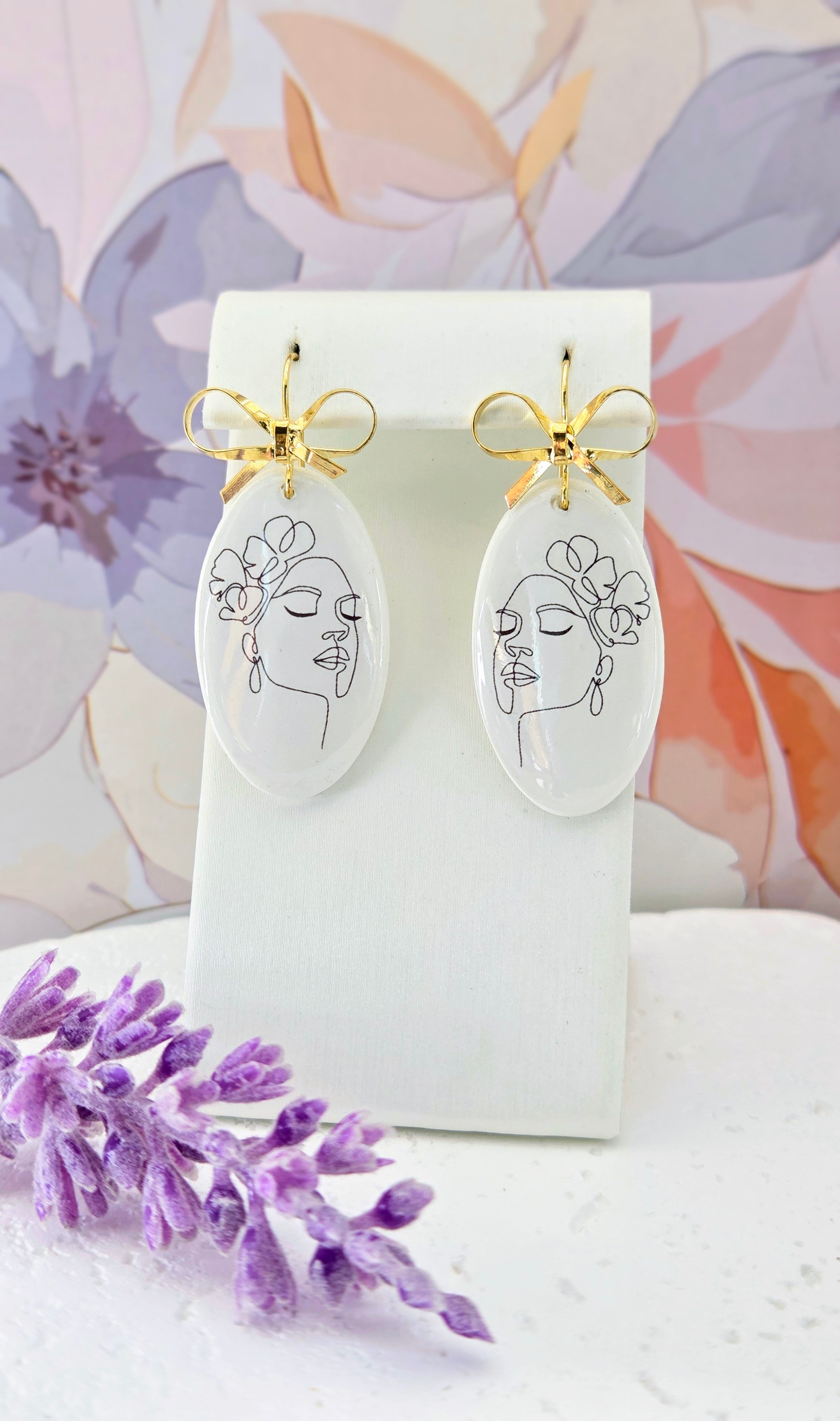 Abstract Face Clay Earrings with Bow Accent