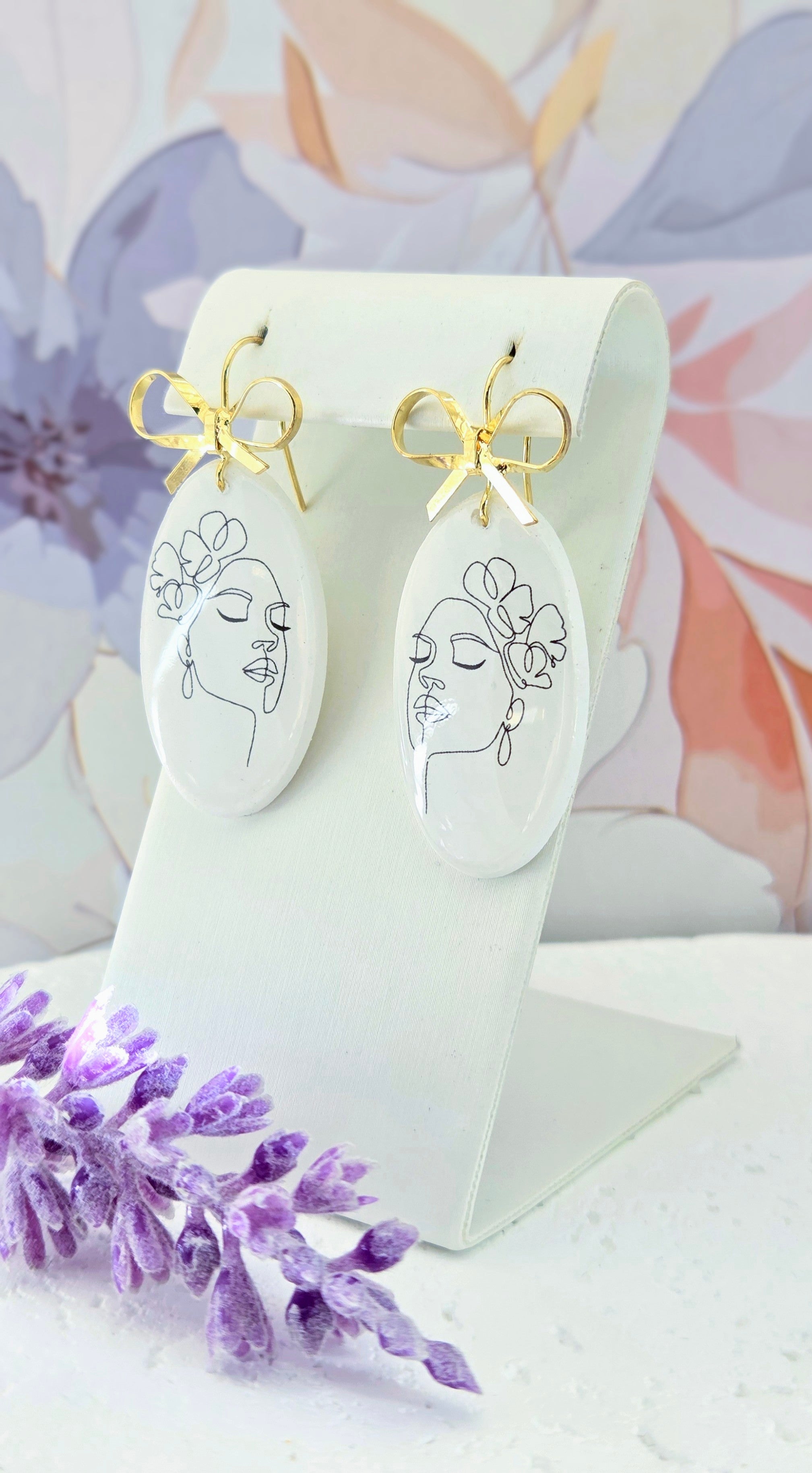 Abstract Face Clay Earrings with Bow Accent