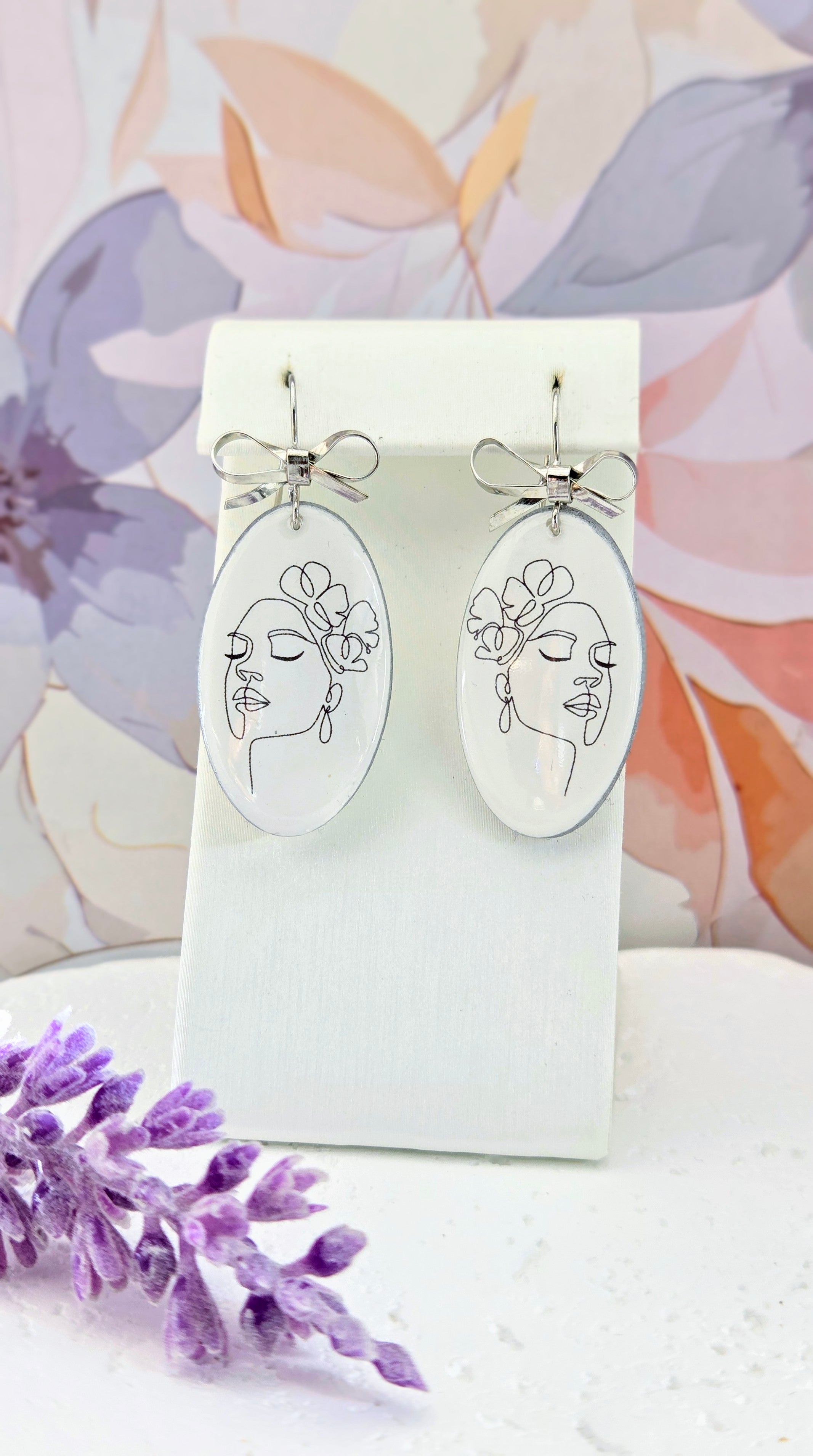 Abstract Face Clay Earrings with Bow Accent
