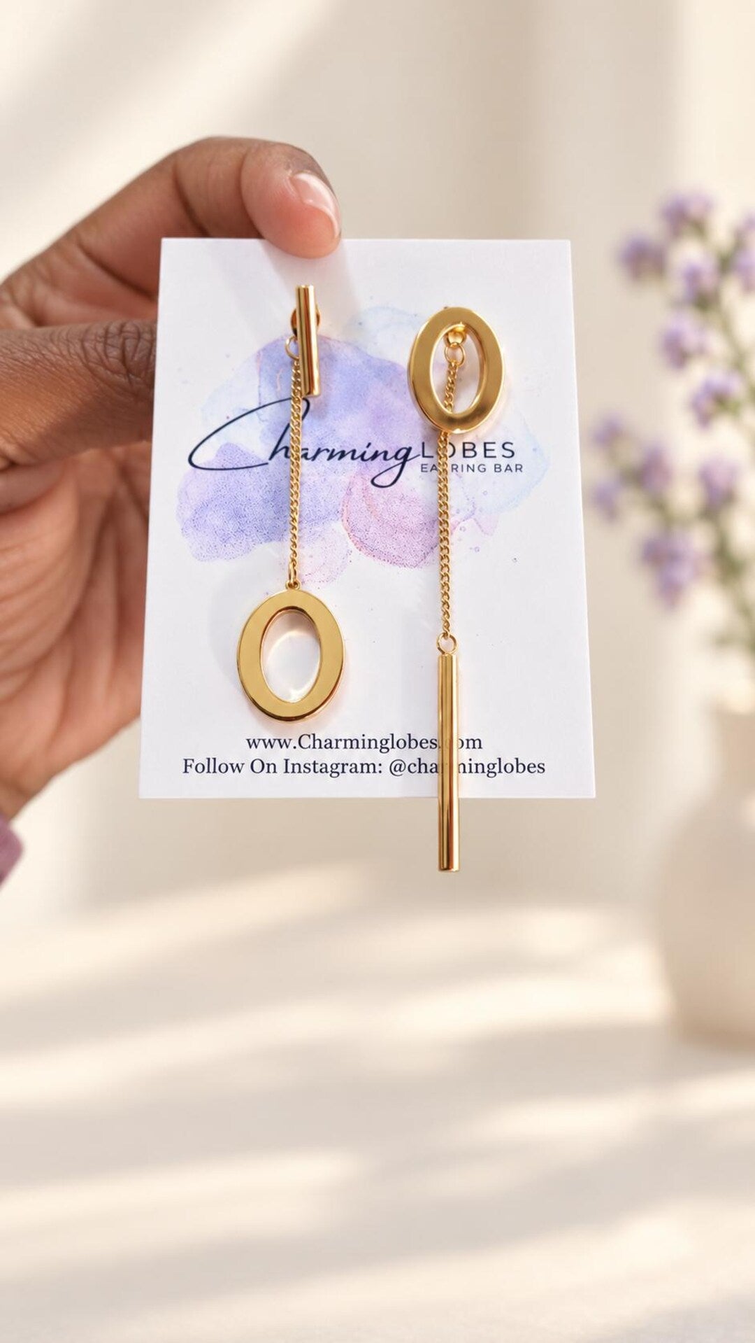 Asymmetrical earrings on Charming Lobes Earring Bar card