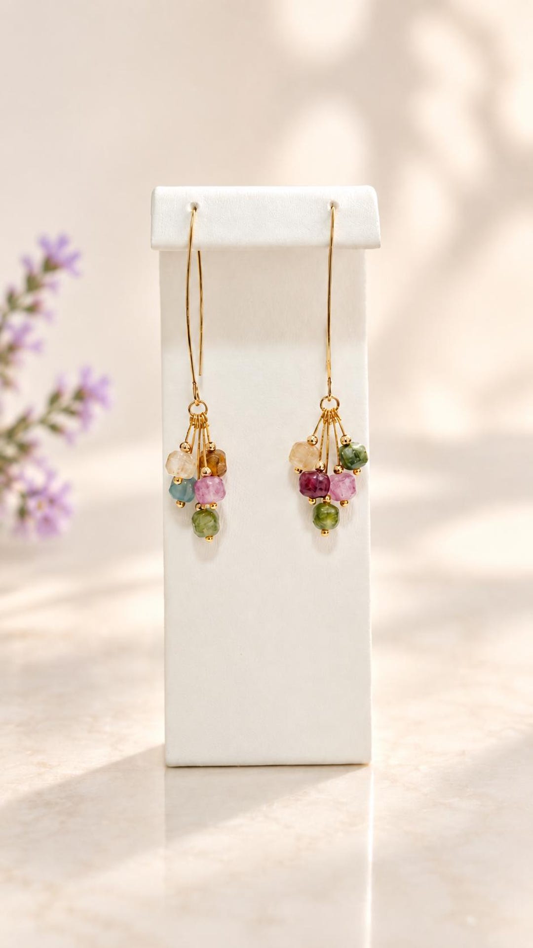 Tourmaline cluster earrings on display stand