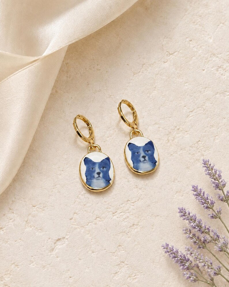 Blue dog charm earrings on gold huggie hoops