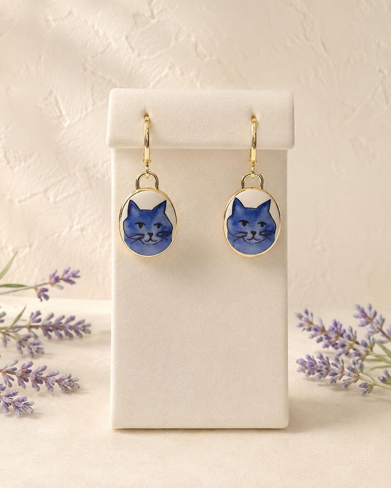 Blue cat charm dangle earrings on gold huggie hoops