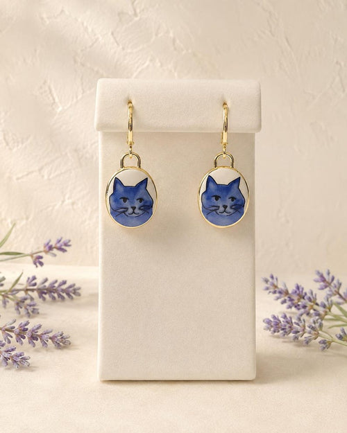 Blue cat charm dangle earrings on gold huggie hoops